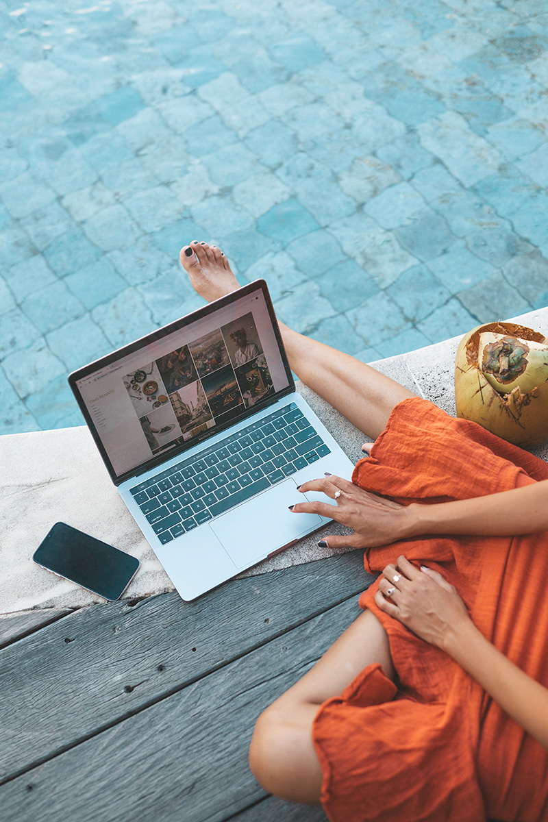 girl working by the pool